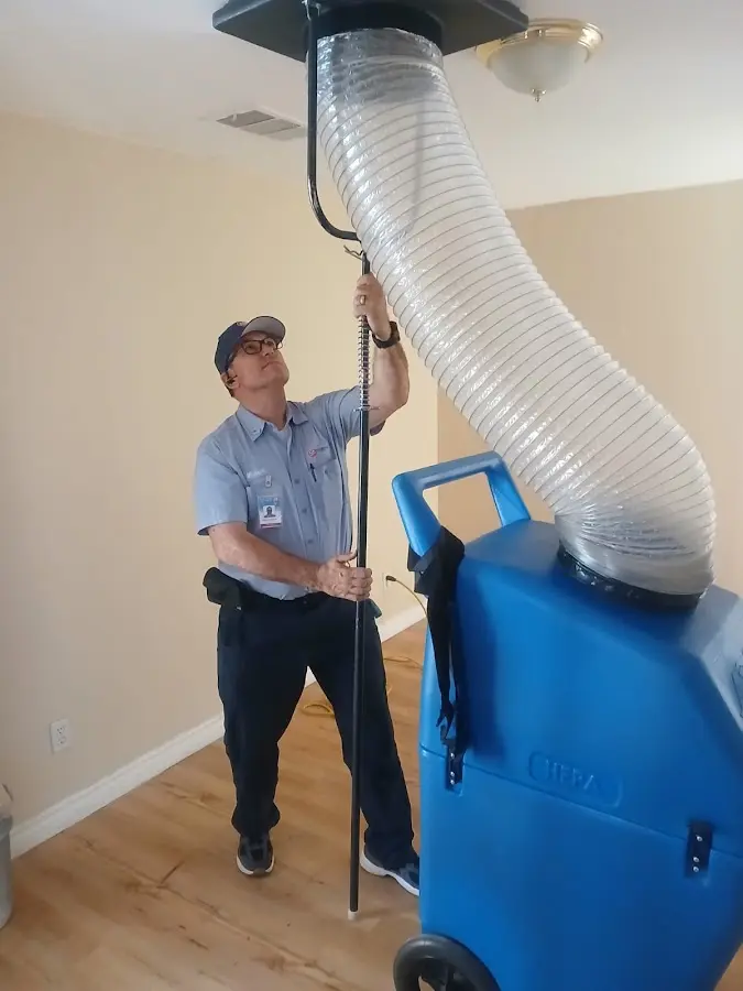 Furnace Tune-Up technician using HEPA equipment in Pelham